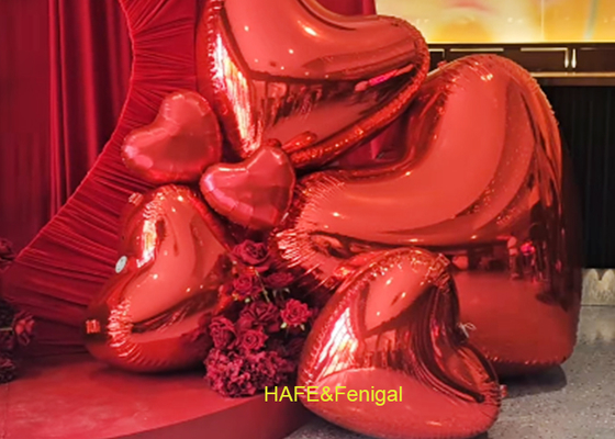 Palloni a specchio rosa o rosso a forma di cuore per San Valentino, feste di anniversario